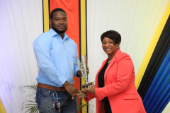 Mr Antonio Johnson receives the JEP Award for Best Electrical and Computer Engineering Graduate, presented by Faculty Representative, Ms Novelin Beckford